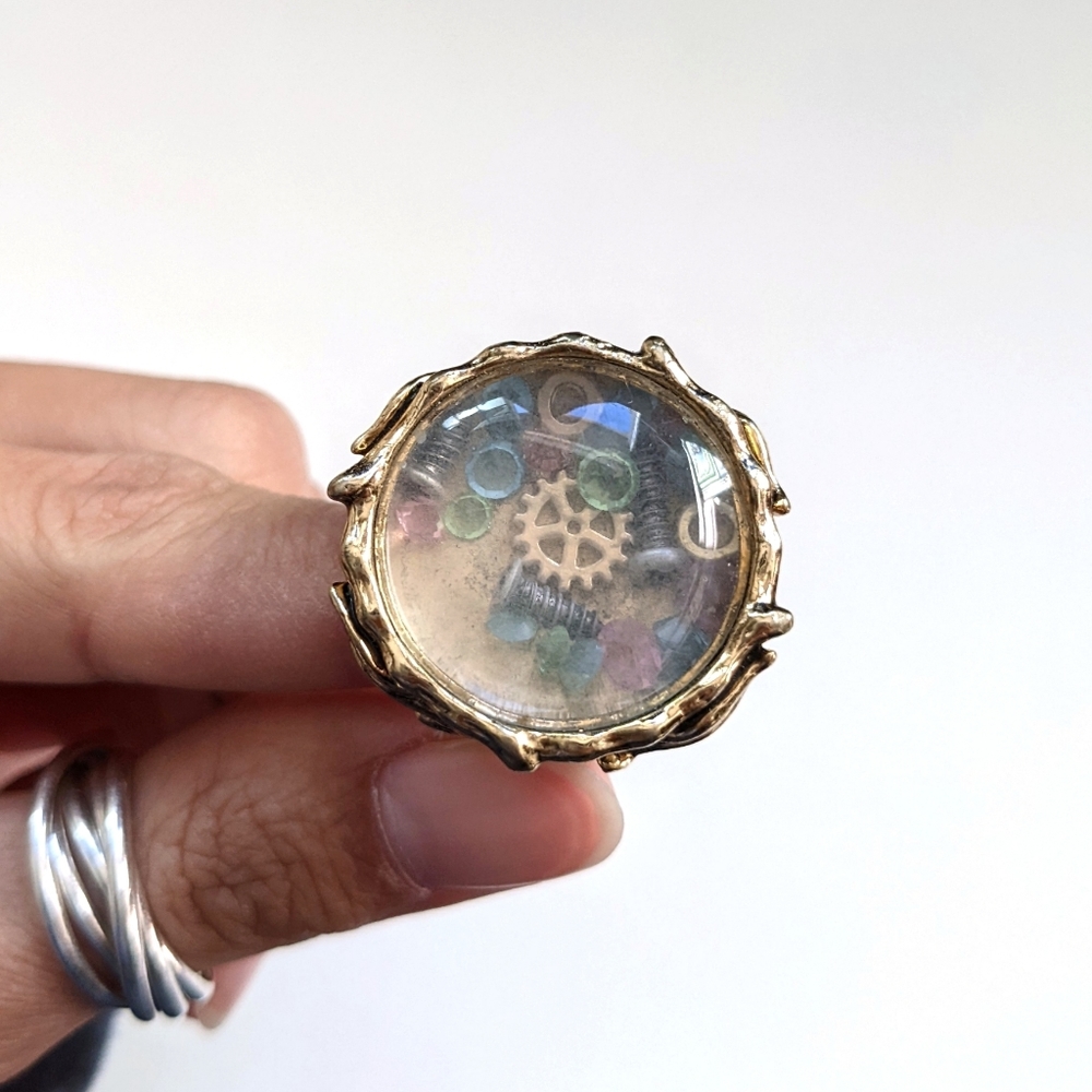 Disney couture ring Peter pan Tinkerbell glass case lost things gears crystals